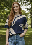Navy and beige patterned tshirt on a woman