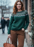 Green sweater with patterned neckline on a white background